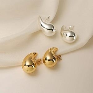 Add a touch of vintage charm with these chunky gold and silver teardrop earrings
