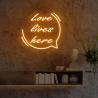 Space with 'Love Lives Here' Red LED Neon Sign
