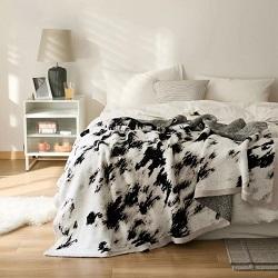 Cozy Ink Wash Knitted Blanket Wrap yourself in warmth and comfort with this cozy ink wash knitted blanket.