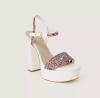 Step into effortless style this season with these white block heel sandals from Guess.