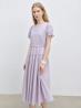 Add a pop of color and elegance to your wardrobe with this purple puff sleeve dress