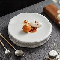 Serve sophistication . These Irregular Ceramic Plates add a modern twist to your table